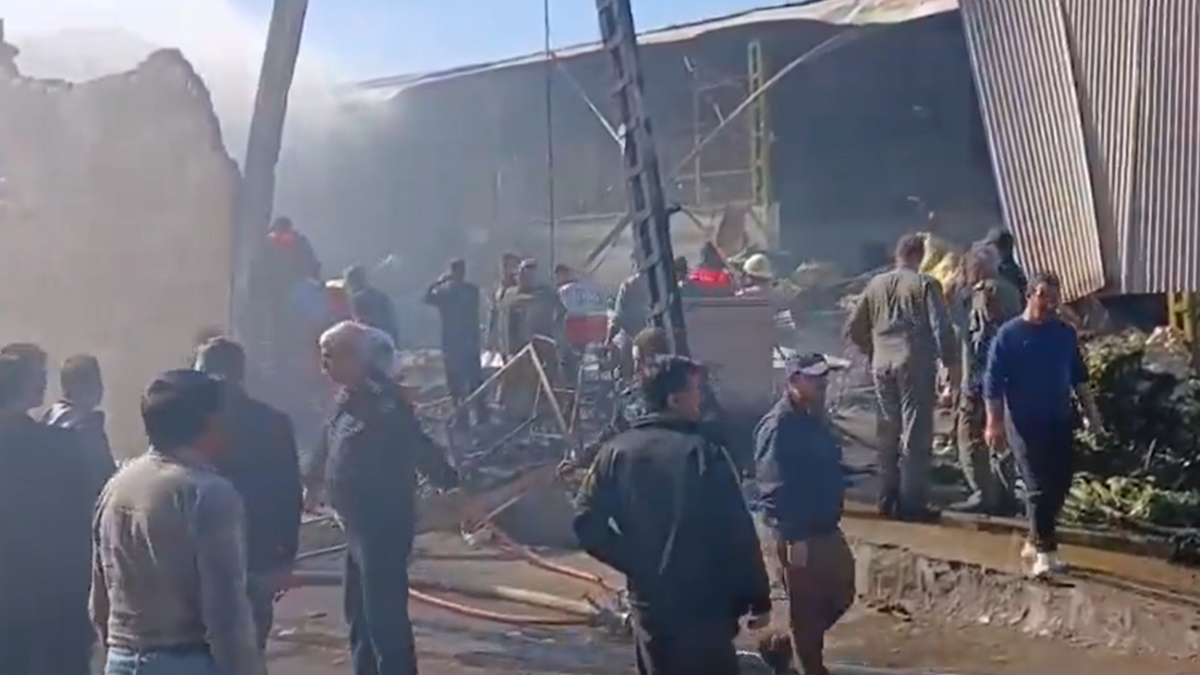 An Iranian army helicopter plummets into a busy market, instantly killing two pilots and two local v...