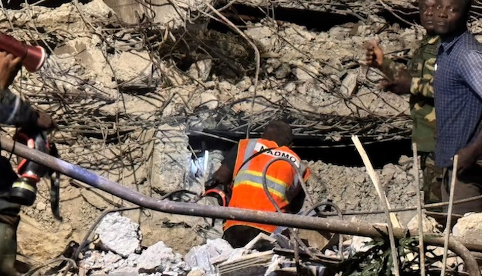 Three people have died and 20 rescued after a three-storey building used as a church collapsed in Ac...