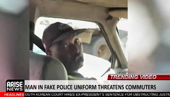 Police review viral footage of a man in police attire accused of threatening passengers on a bus in...