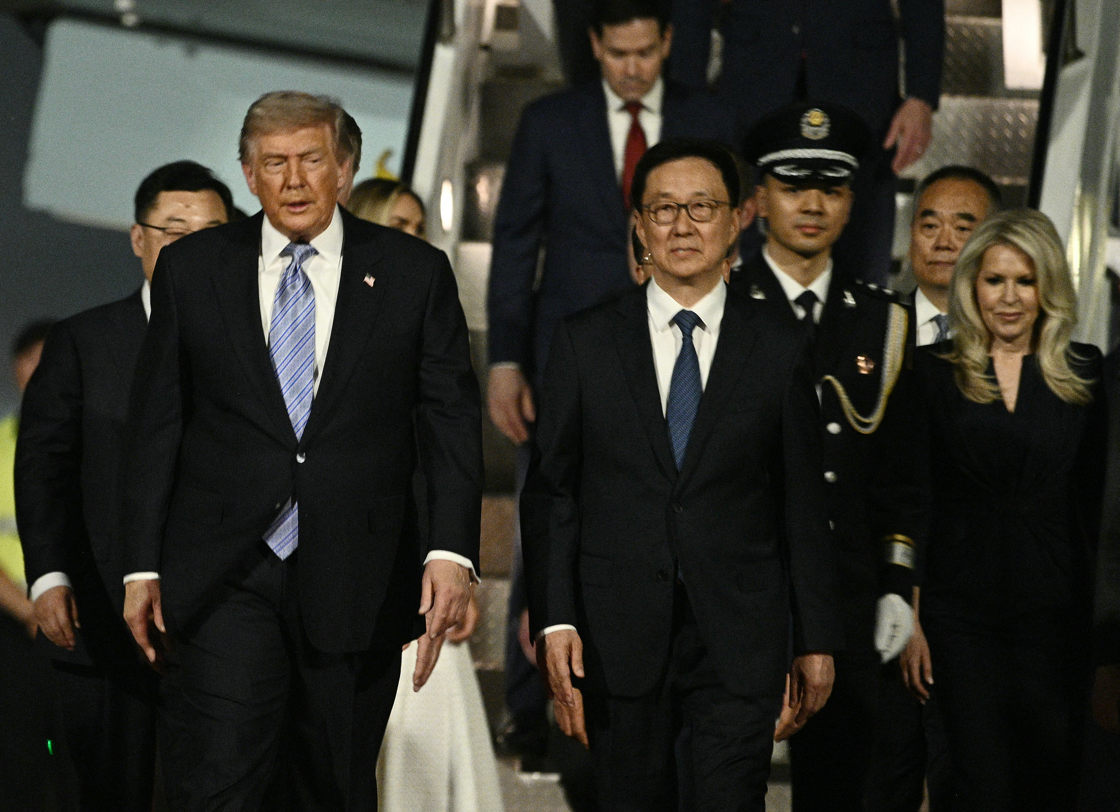 Trump lands in Beijing for a high-stakes two-day visit with Xi Jinping as tariffs, tech and Taiwan d...