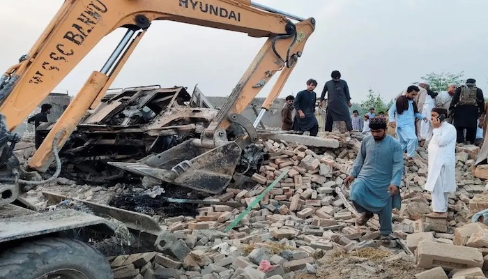 Car bombing and armed ambush on police post in northwest Pakistan kills at least 14 officers, offici...