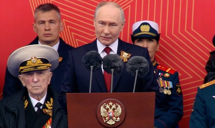Putin accuses Nato of backing aggression against Russia as Moscow stages reduced Victory Day militar...