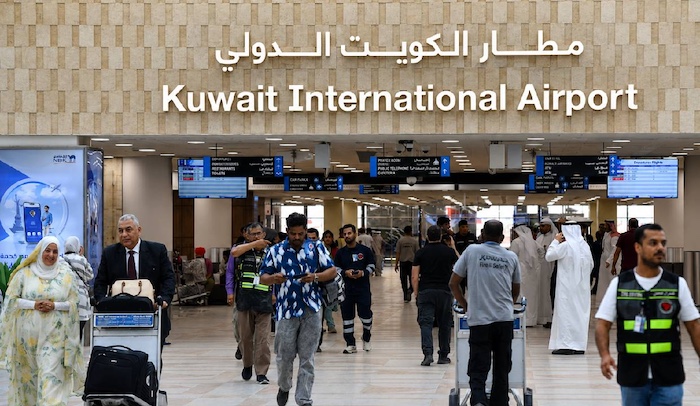  Iranian missiles and drones hit Kuwait airport, as US forces intercept attacks targeting Bahrain an...