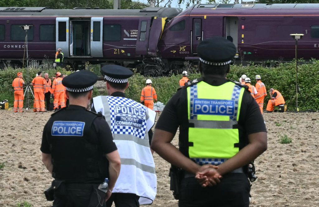 UK accident investigators were on Saturday probing the cause of a train collision north of London wh...