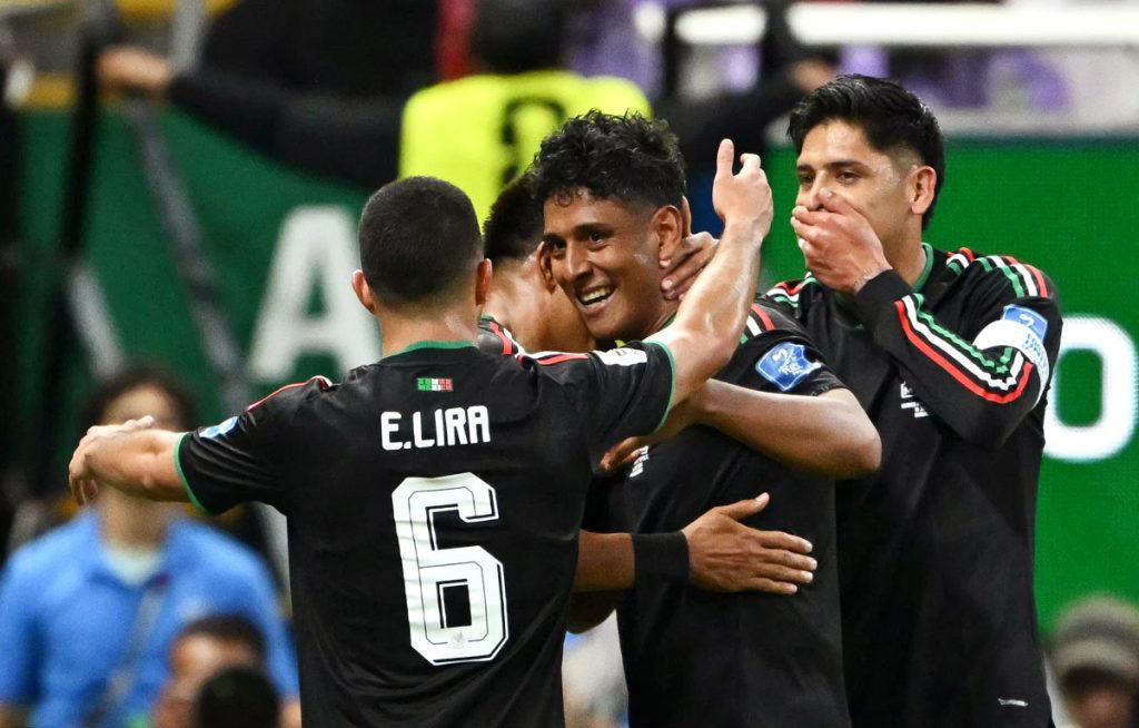 Co-hosts Mexico became the first team to reach the knockout rounds of the World Cup with a 1-0 win o...