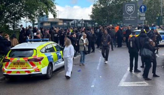 A 14-year-old girl has been arrested after a knife attack at a Manchester school left three people i...