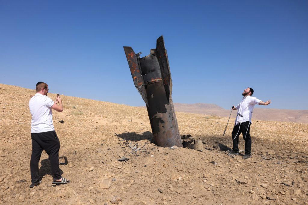 Israel and Iran traded fire on Monday, seriously testing a fragile truce and threatening hopes for a...