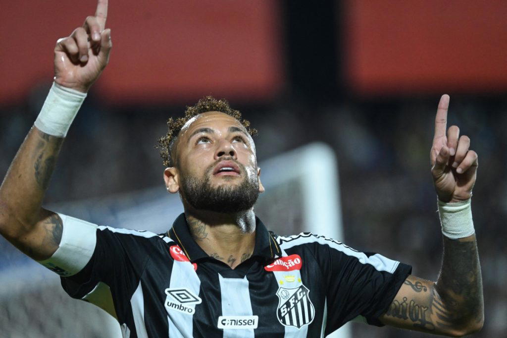 Neymar scored twice for Santos and responded to his critics with a tongue-in-cheek goal celebration...