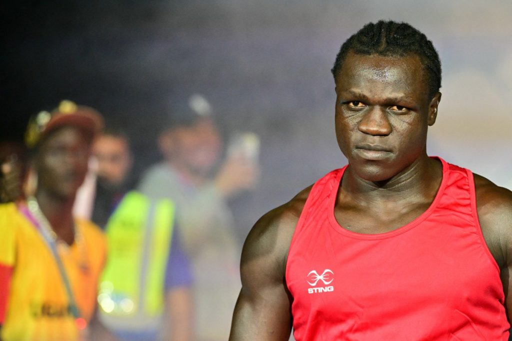 The grandson of former Ugandan president Idi Amin saw his bid for Commonwealth boxing gold end in di...