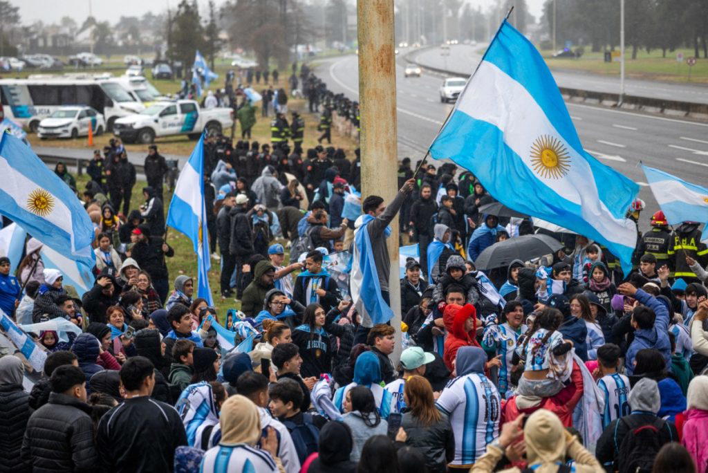 Most of Argentina’s football team landed back home Monday, as thousands of fans waited to welcome th...