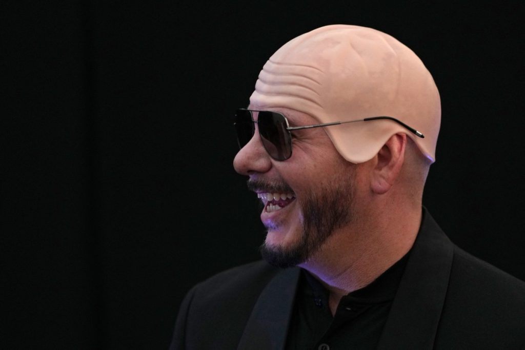 US rapper Pitbull has set the first Guinness World Record for the largest gathering of people wearin...