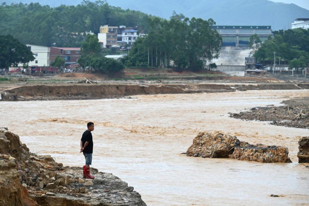 Rescuers scoured flooded parts of China for survivors on Wednesday as residents began cleaning up th...