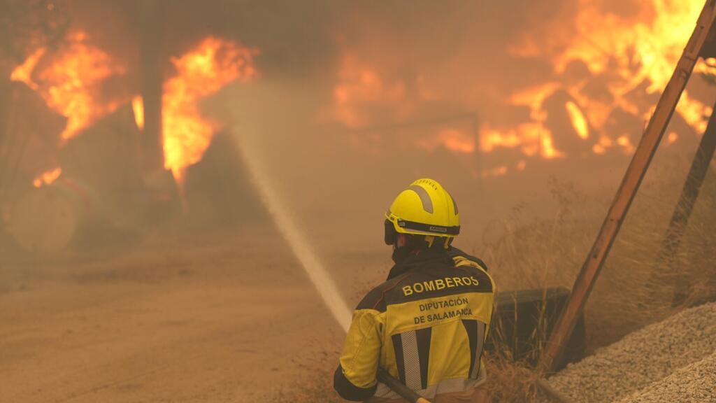 Out-of-control wildfires in Spain and France that have forced the evacuation of more than 200,000 pe...