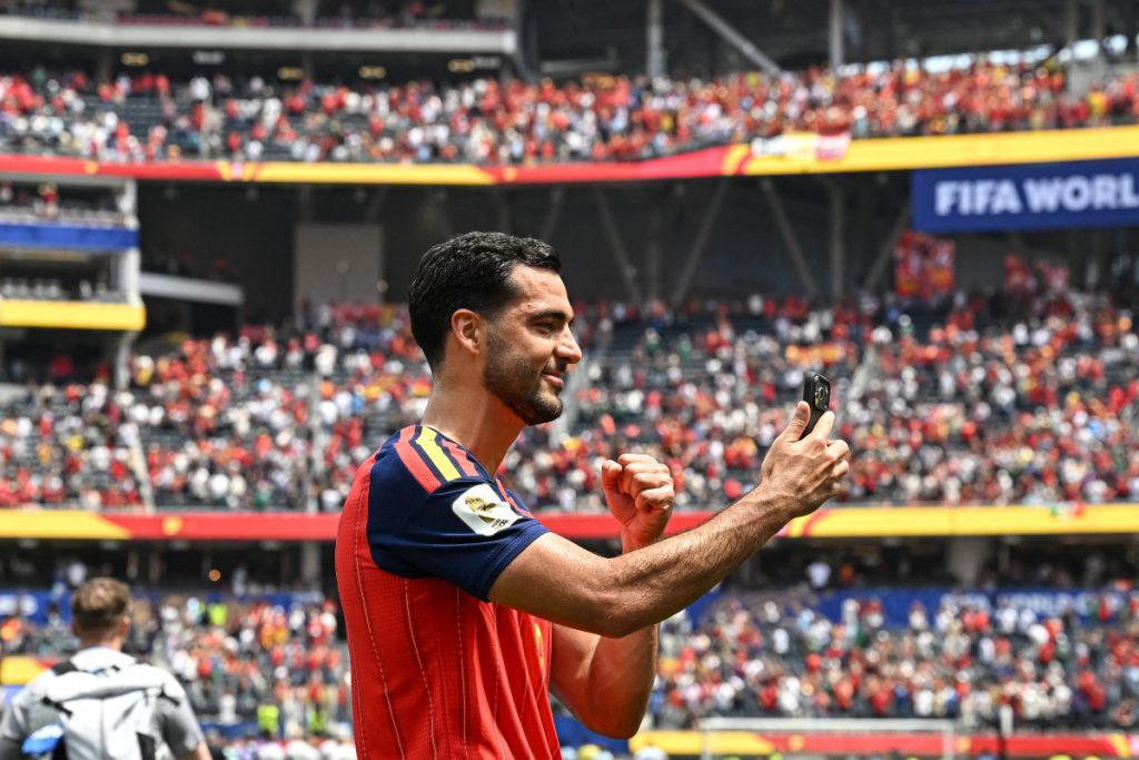 Super sub Mikel Merino broke Belgian hearts and sent Spain through to a World Cup semi-final against...