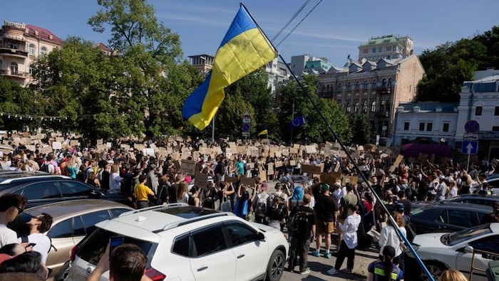 Demonstrators oppose President Zelensky's decision to remove Defence Minister Mykhailo Fedorov from...