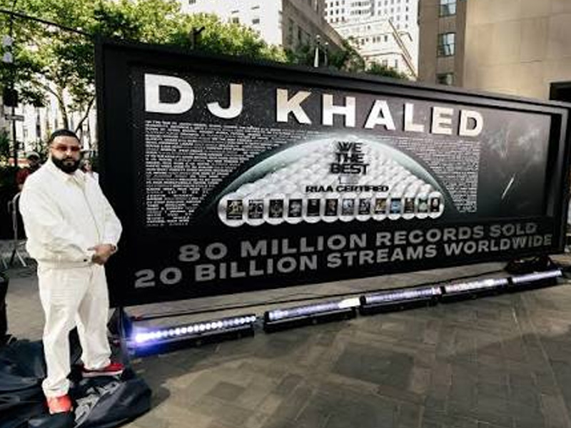 DJ Khaled receives a billboard-sized RIAA Lifetime Legacy Plaque marking 20 years, 80 million record...