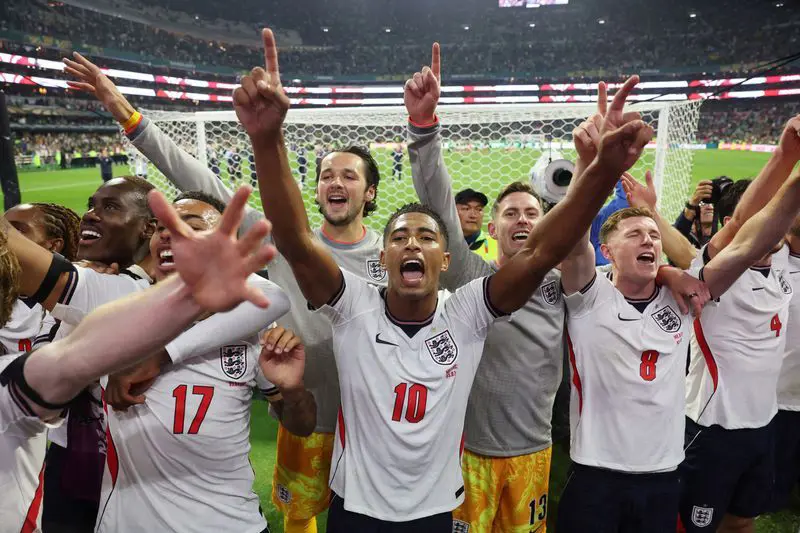 England overcame a storm delay and second-half red card to beat Mexico 3-2, and book a World Cup qua...