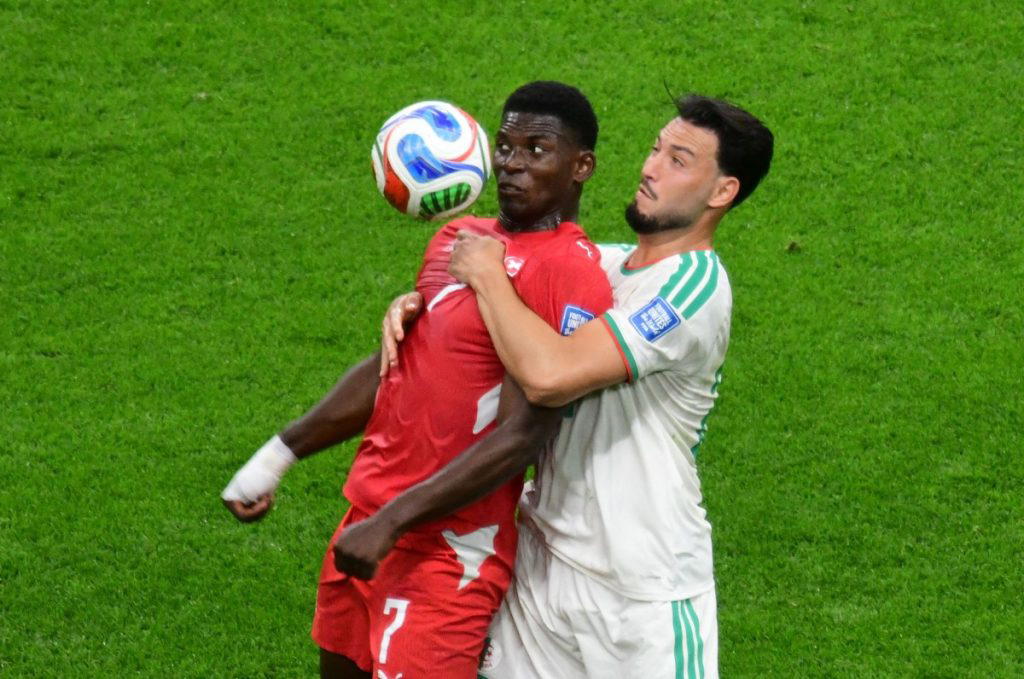 Switzerland moved into the last 16 of the World Cup with a controlled 2-0 win against Algeria on Thu...