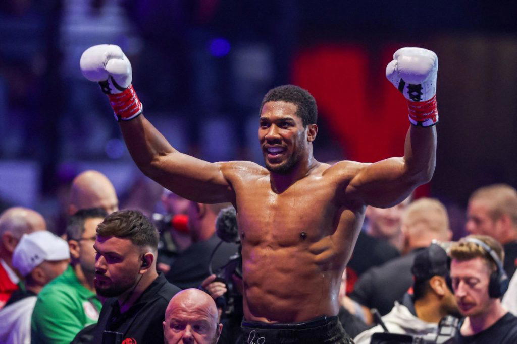 Two-time heavyweight world champion Anthony Joshua survived two early knockdowns on the way to a sec...
