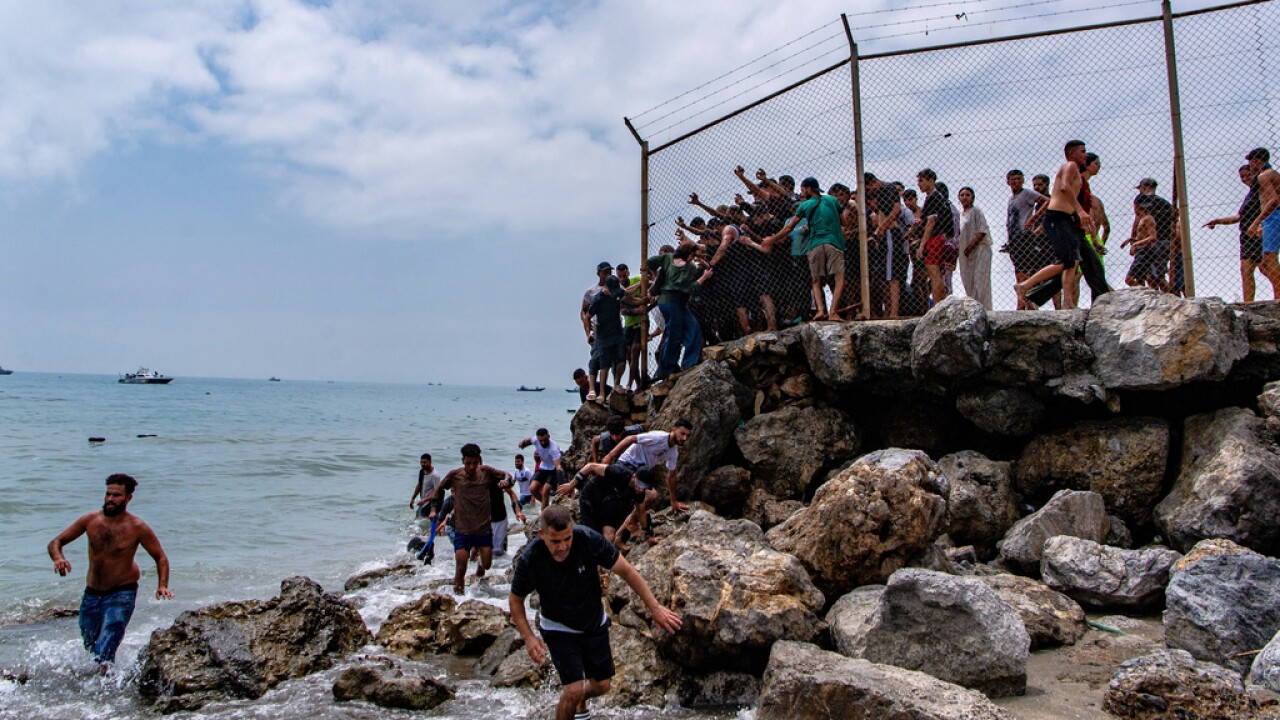 Spain deploys troops to Ceuta after thousands of migrants cross from Morocco, overwhelming authoriti...