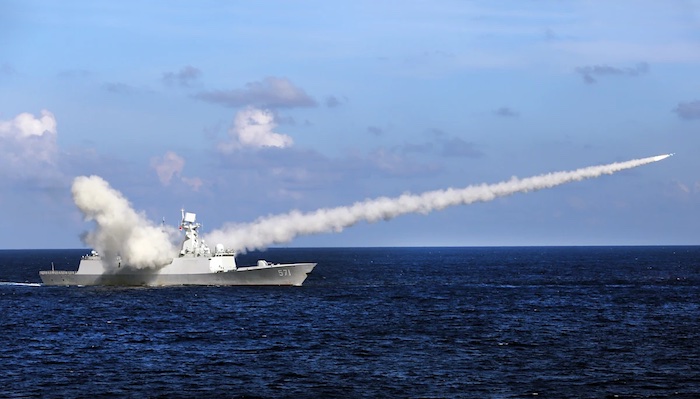 China tests a ballistic missile in the Pacific hours after Australia and Fiji sealed a defence allia...