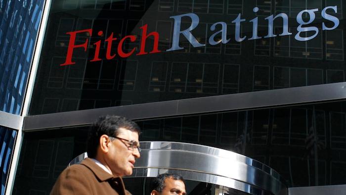 Fitch says stronger capital buffers have helped Nigerian banks withstand a surge in impaired loans a...