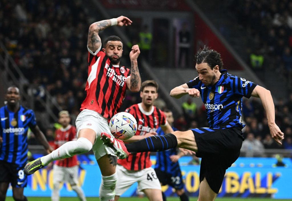 Frenchman Christopher Nkunku converted a late penalty as AC Milan drew 1-1 with rivals Inter Milan i...