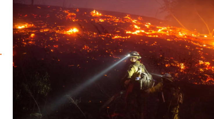 A fast-moving wildfire neared the US city of Spokane on Saturday, forcing thousands of residents to...