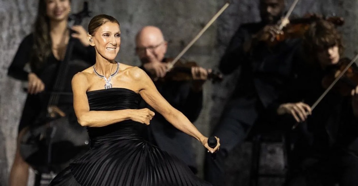 Céline Dion makes an emotional return to live performances in Paris, telling 30,000 fans she kept he...