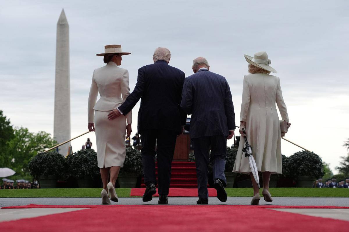 President Trump gives first lady Melania a playful tap on the tush during meeting with King Charles...
