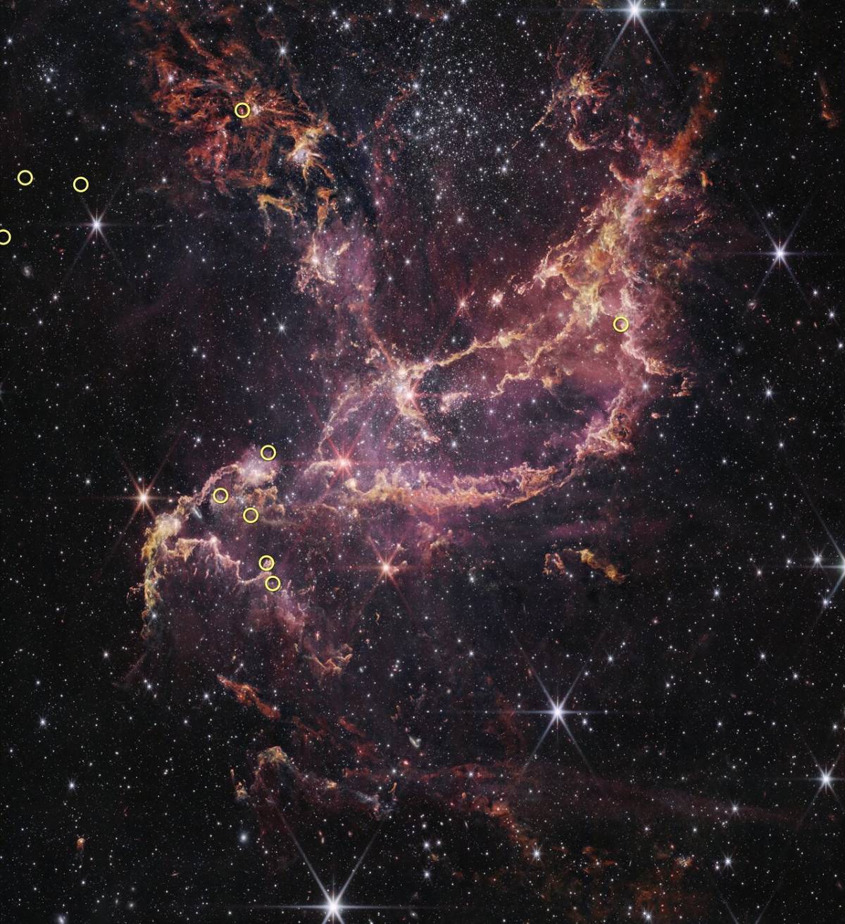 The center of the image contains arcs of orange and pink that form a boat-like shape. One end of the...