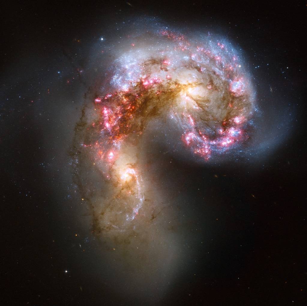 Two immense galaxies, locked in a cosmic collision 50 million light-years from Earth.
Credit: NASA,...