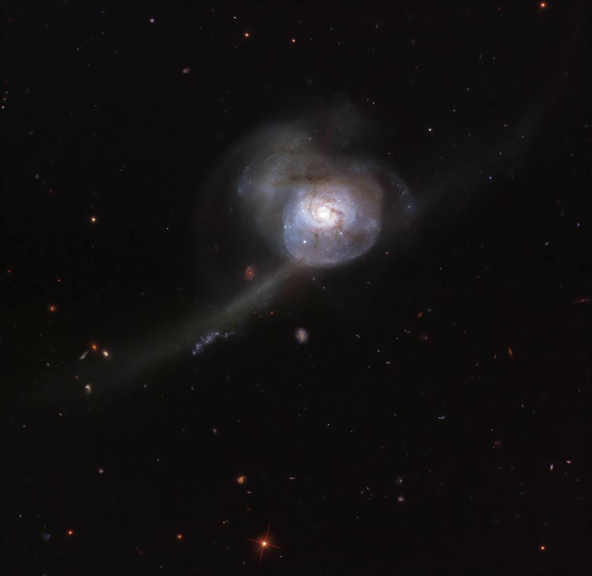 A spectacular galactic collision!
In this striking Hubble Space Telescope image, NGC 34 shines wit...