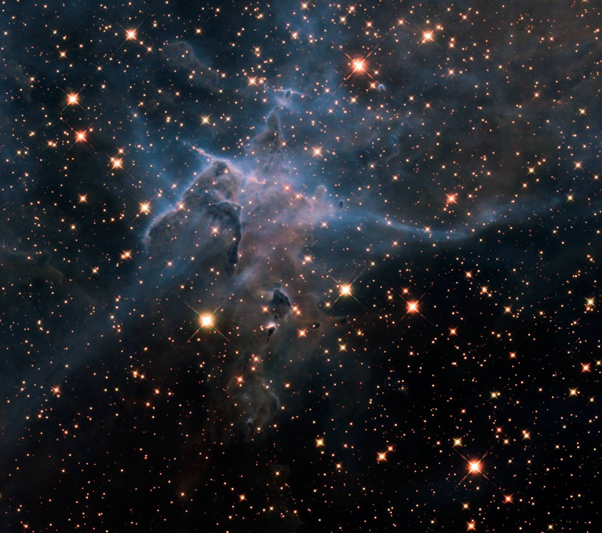 Spectacular: This towering pillar of gas and dust stretches three light-years through space, slowly...