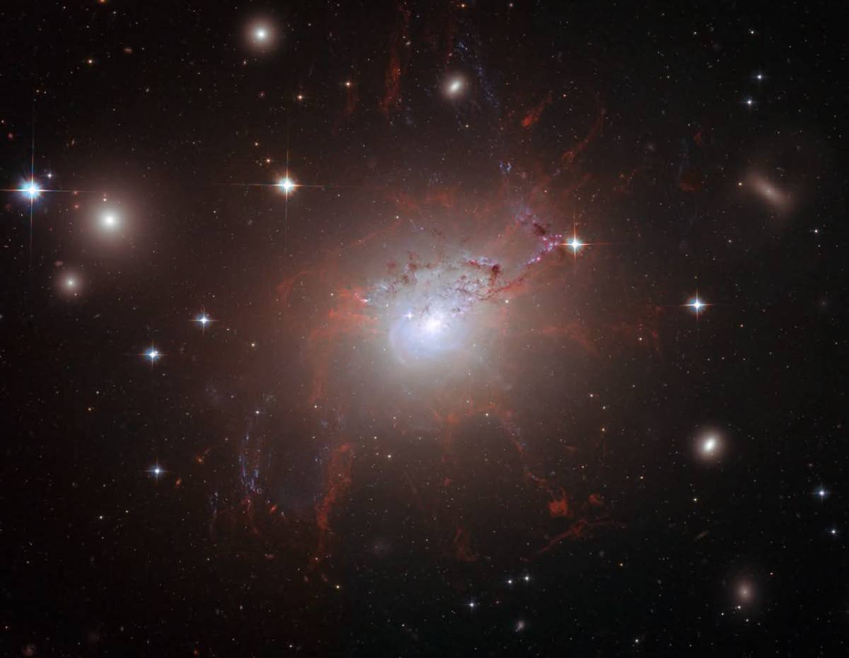 Twenty years ago today, Hubble locked its gaze on the fiery heart of galaxy NGC 1275—and what it cap...
