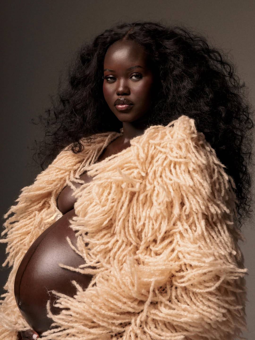 Sudanese-Australian supermodel Adut Akech shared her new maternity portraits. Photography by Dalvin...