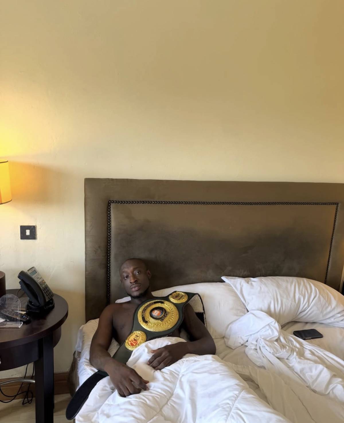 Carter Efe shares a new photo with his belt after beating portable in a boxing bout