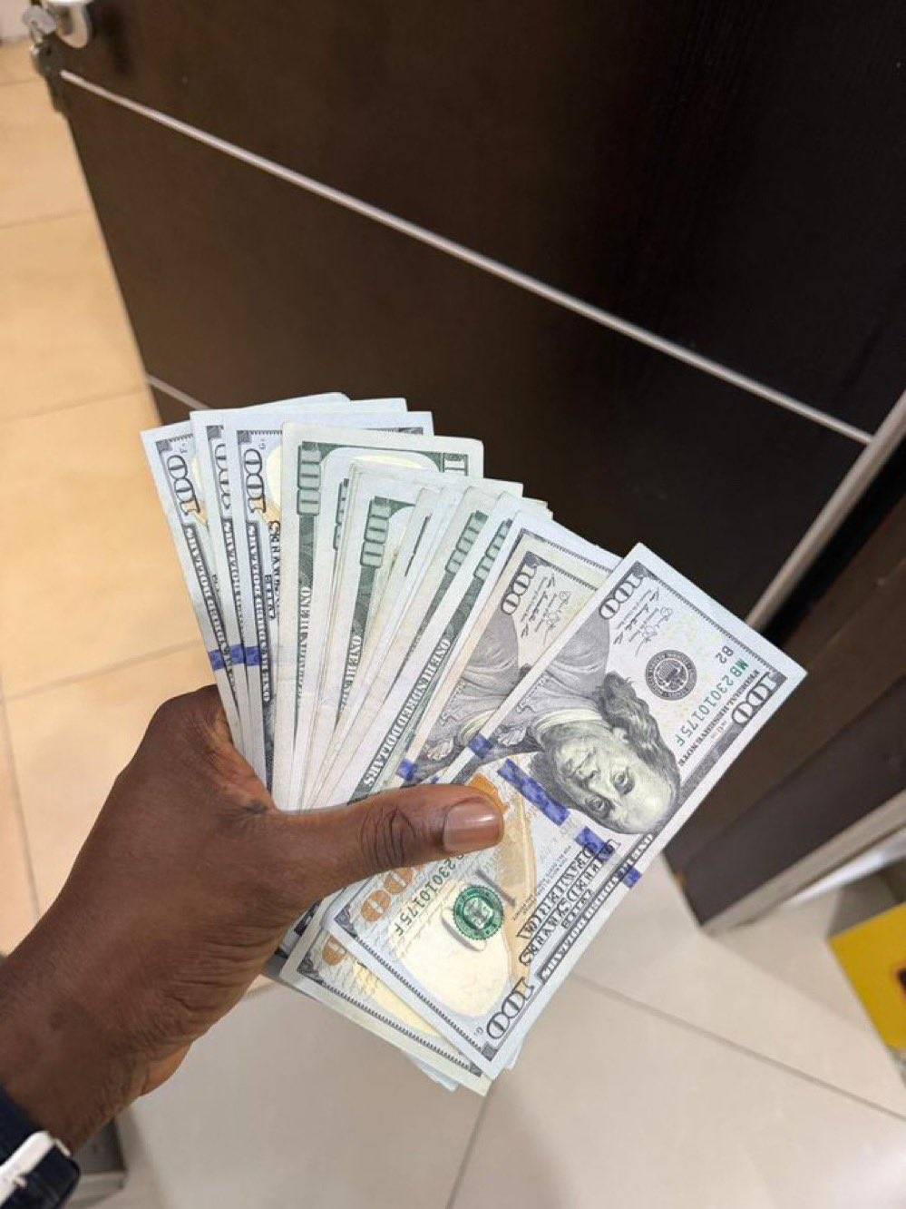 Burna boy gifts nasboi bundles of dollars