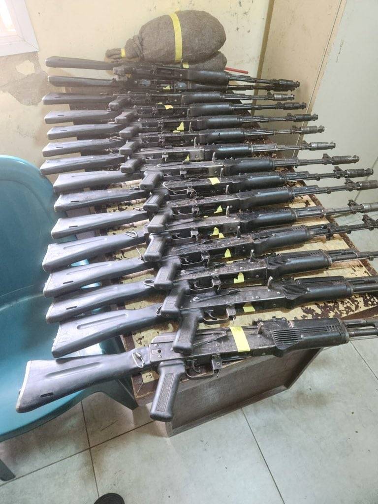Photo of weapons Recovered from the men, including 15 AK rifles and 1,434 rounds of live ammunition.