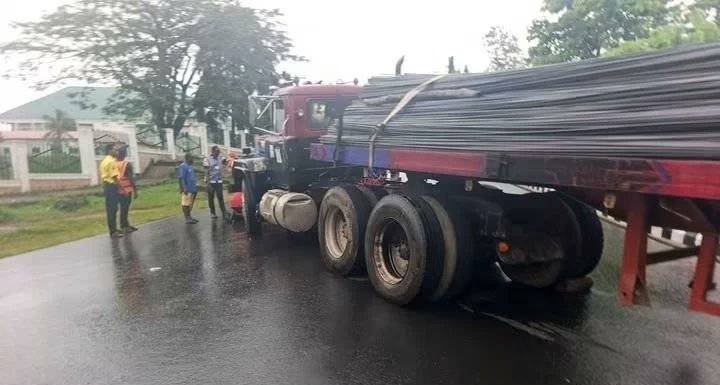 A heavy-duty trailer loaded with iron rods crashed into the perimeter fence of the Federal Medical C...