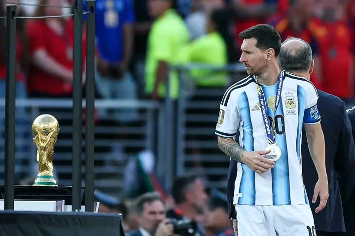Moment Lionel Messi looks back at the trophy following their defeat to Spain in the 2026 World Cup f...