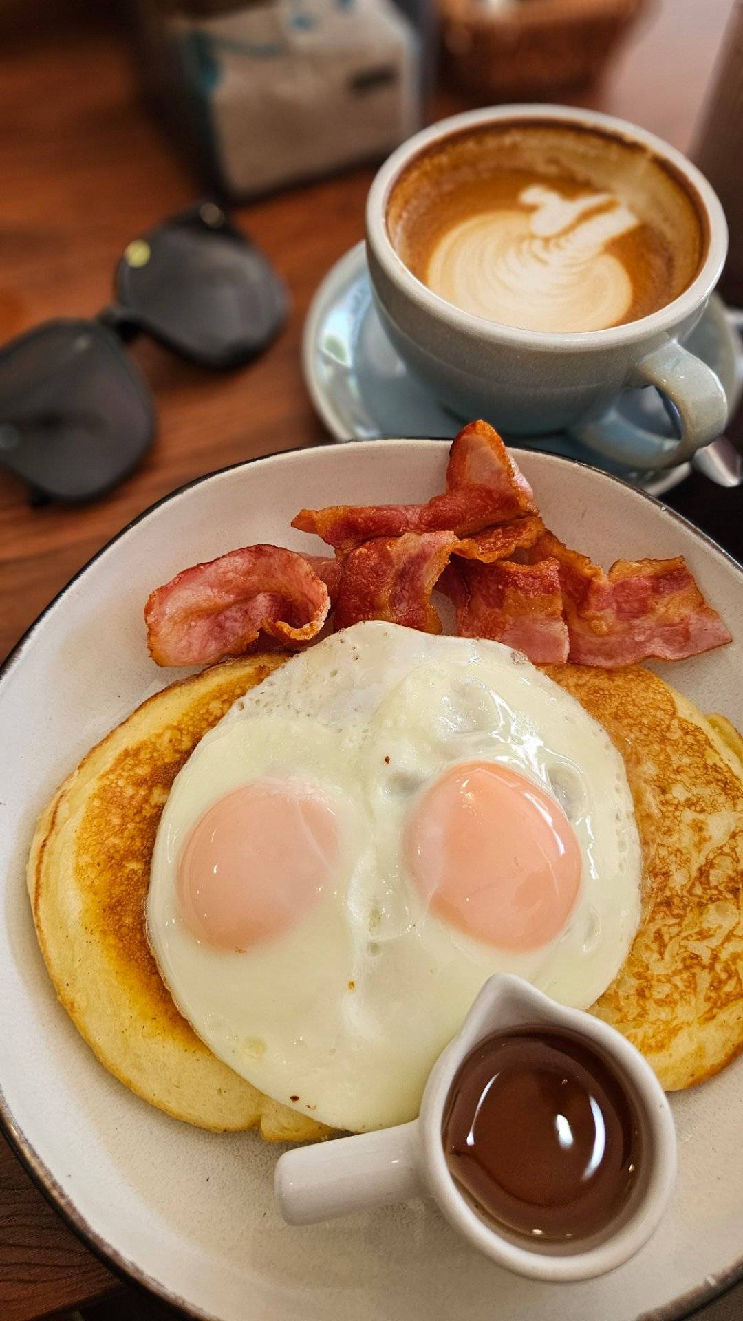 I went back to my fav breakfast place!
Coffee, pancakes, bacon, eggs, maple syrup; a perfect brekky...