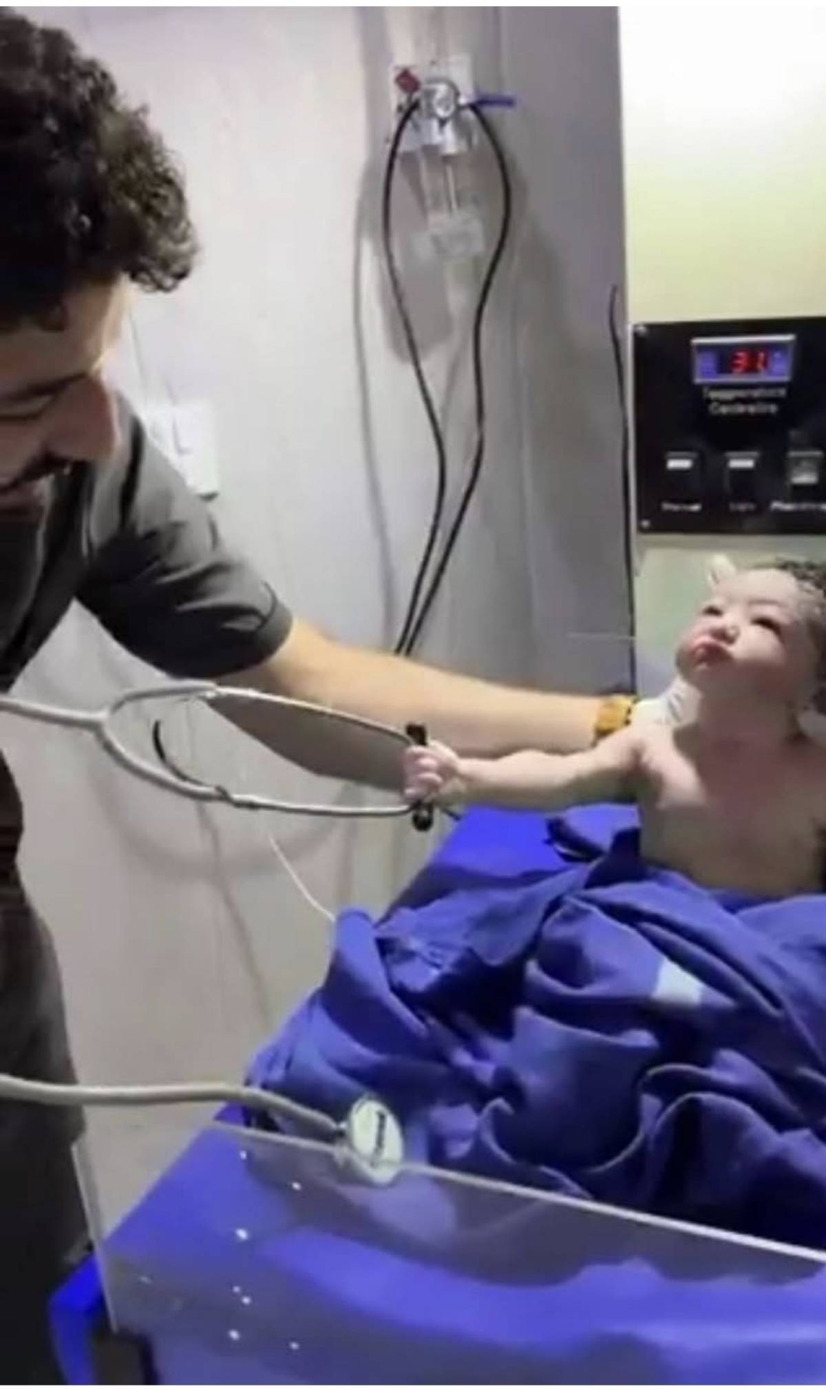 Funny moment newborn baby refuses to release doctor's stethoscope during examination. Most of the ne...