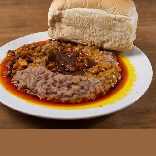 In the early 2000s, I remember a neighbour who visited from the US.
He saw me eating 'ewa agoyin' w...