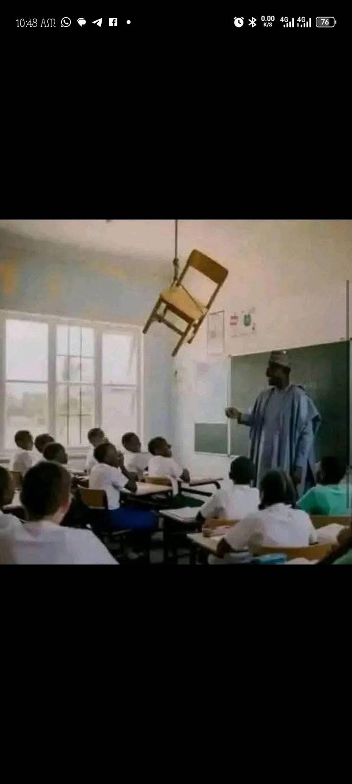 A teacher entered the classroom and found the chair he was supposed to sit in hanging from the ceili...
