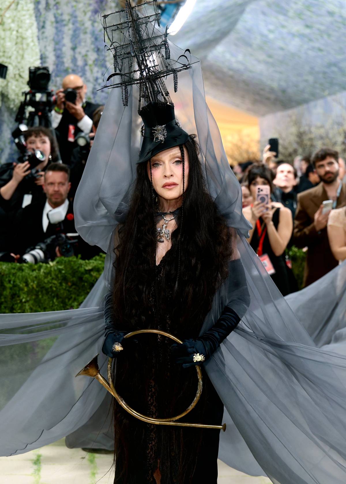 Madonna wearing a look inspired by Leonora Carrington's painting "The Temptation Of St. Anthony. Fra...