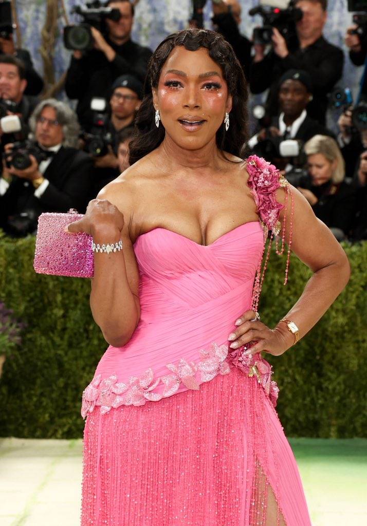 American actress Angela Bassett wearing custom Prabal Gurung and referencing "Girl in Pink Dress" (1...
