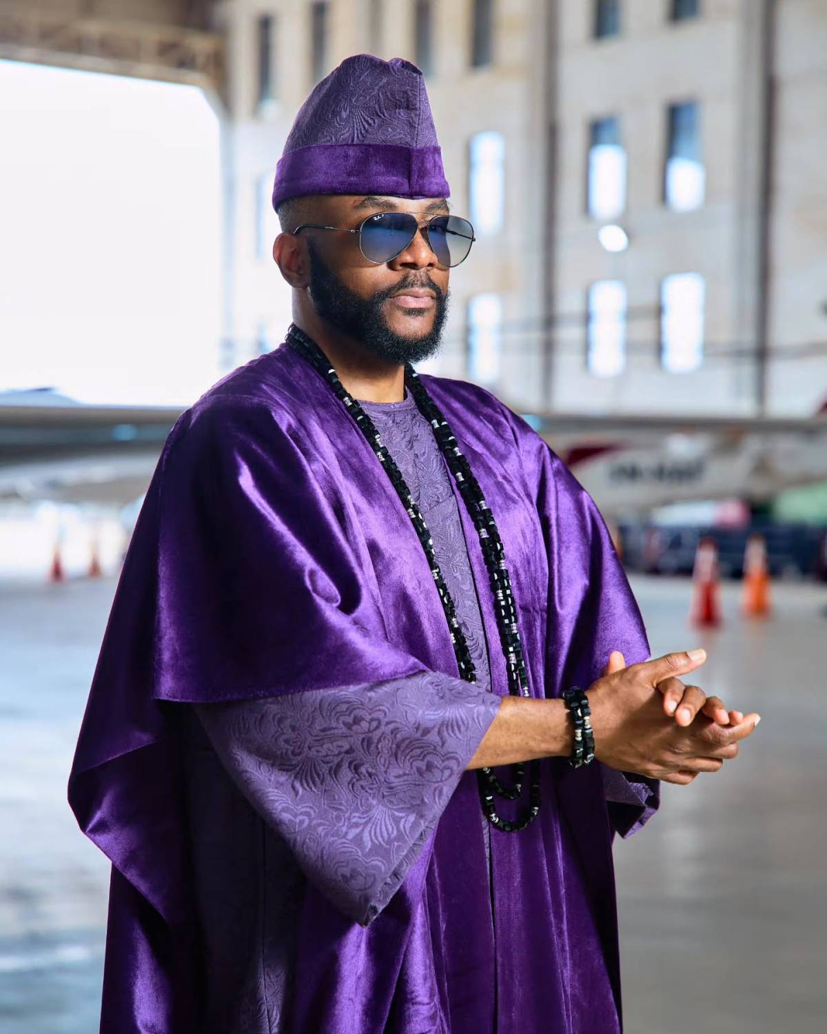 Ebuka Obi-Uchendu wore a stunning deep purple velvet agbada designed by Nigerian brand D29 Africa to...