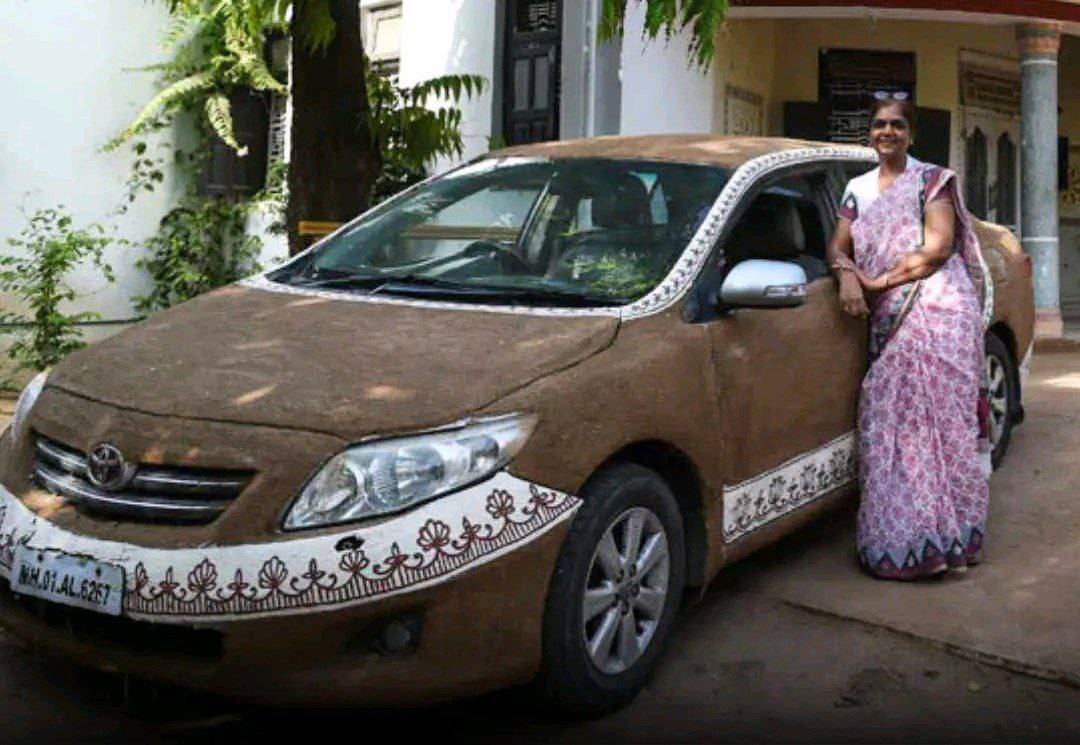 A woman from India covered her car with cow Poop, believing it cools the car without air conditionin...