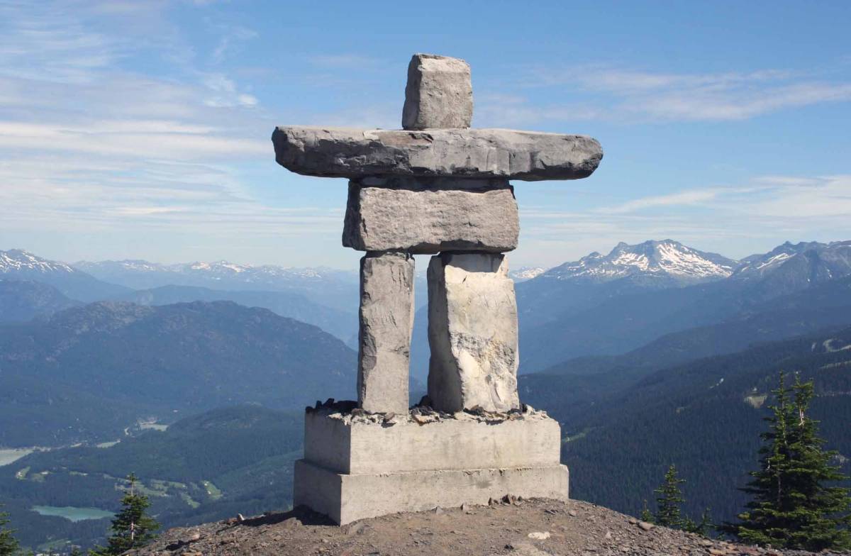 Over the plains of Canada, the Inukshuk stone figures, built by Inuit since 1000 AD, guide travelers...
